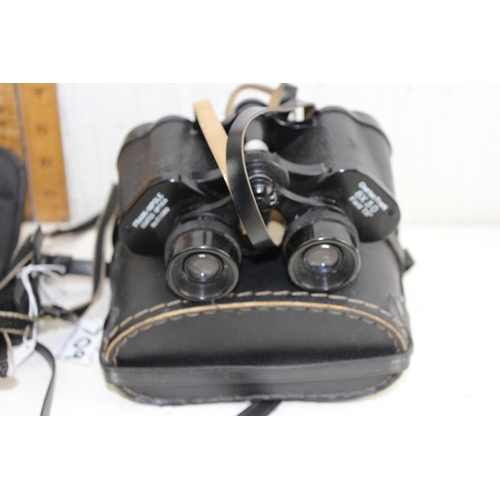 709 - 2 pairs of cased binoculars - This lot is being sold on behalf of the Style Acre charity