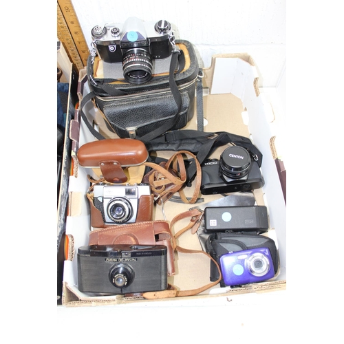 710 - 2 boxes of assorted cameras and camera related accessories etc - This lot is being sold on behalf of... 