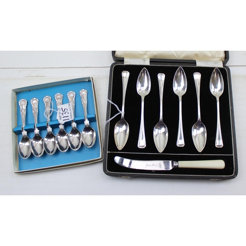 1135 - A boxed set of silver plated grapefruit spoons and a silver plated set of tea spoons