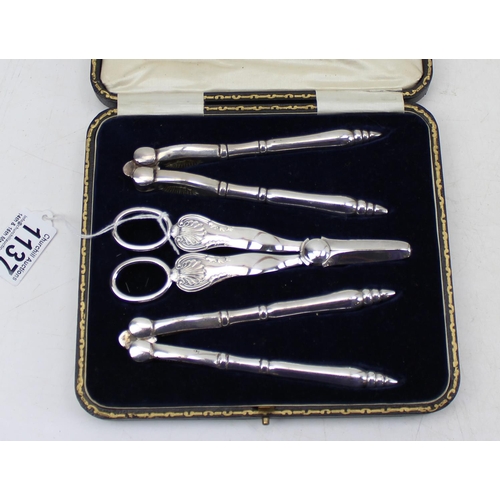 1137 - An antique boxed set of 2 nut crackers & a pair of grape scissors