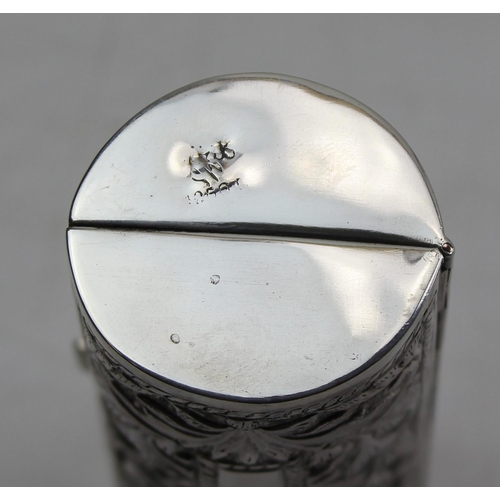 1150 - A cylindrical white metal box with embossed design, various illegible markings, approx 56g gross wei... 