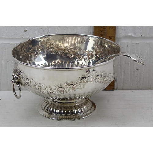 1151 - A large silver plate on copper punch bowl with embossed decoration and a silver plated ladle