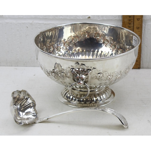 1151 - A large silver plate on copper punch bowl with embossed decoration and a silver plated ladle