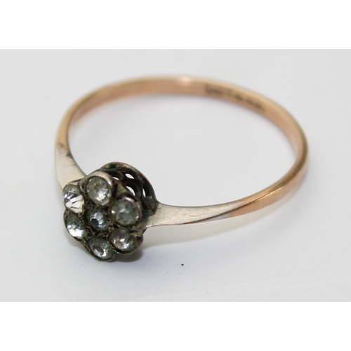 1235 - 9ct gold and silver set white stone ring in a floral pattern, approx size K