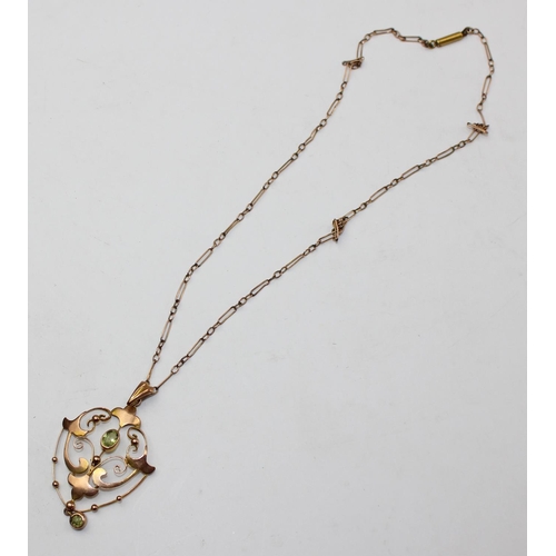 1236 - An Edwardian 9ct gold pendant set with light green stones, likely Peridot, on unmarked yellow metal ... 