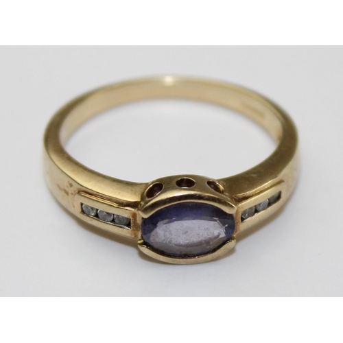 1239 - A 9ct gold diamond & Iolite ring, approx size N, approx 2.71g gross weight, with paperwork