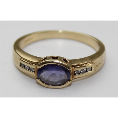 1239 - A 9ct gold diamond & Iolite ring, approx size N, approx 2.71g gross weight, with paperwork