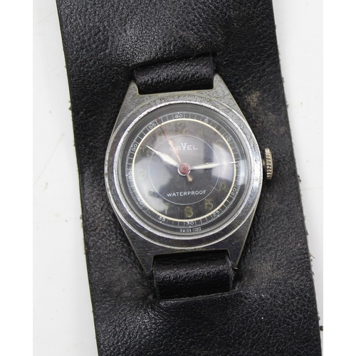 1403 - An unusual Orvel mechanical wristwatch, Swiss made with luminous dial and black leather strap, possi... 