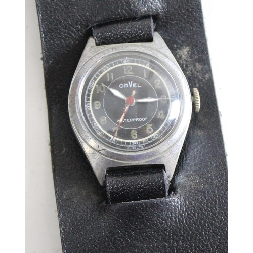 1403 - An unusual Orvel mechanical wristwatch, Swiss made with luminous dial and black leather strap, possi... 