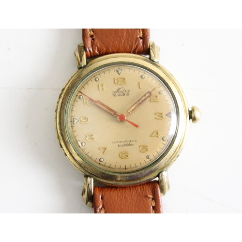 1404 - A vintage Nostra wristwatch in gold plated case, the face marked 16 Rubis Antimagnetic Bruchsicher, ... 