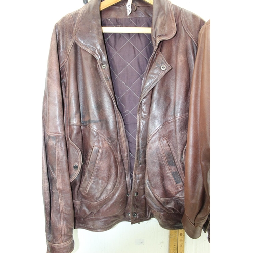 202 - 2 brown leather jackets, one size Large & Sardar size Medium