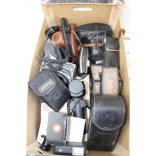 714 - A large qty of assorted cameras and lenses etc to inc Polaroid Land camera, Nikon etc