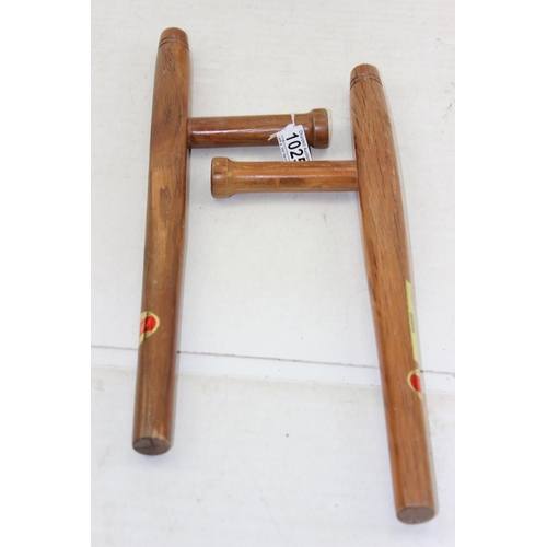 1025 - A pair of Red Oak Tonfa Okinawan martial arts sticks - This lot is being sold on behalf of the Islan... 