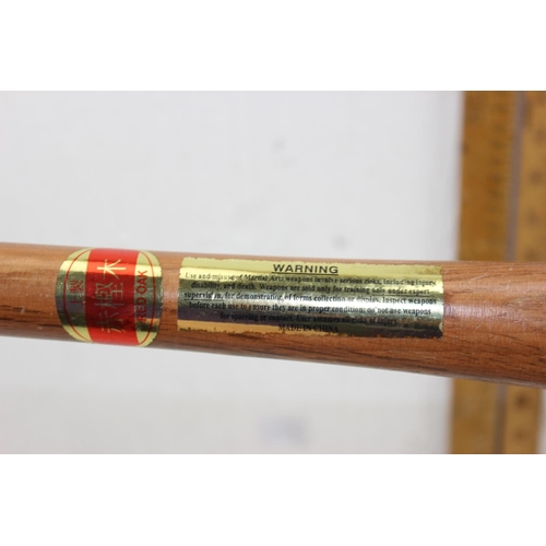 1025 - A pair of Red Oak Tonfa Okinawan martial arts sticks - This lot is being sold on behalf of the Islan... 