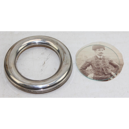 1158 - Silver topped glass jar and a silver mounted photograph frame