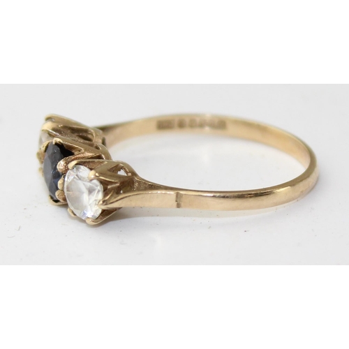 1248 - 9ct gold ring with a central blue stone flanked by a pair of white stones, full English hallmarks, a... 