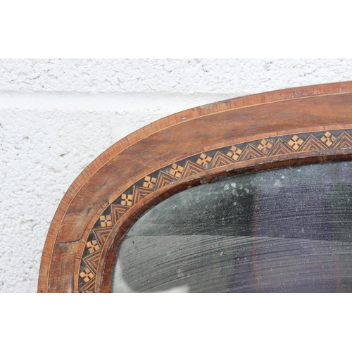 528 - A large wooden framed overmantel mirror with inlaid decoration