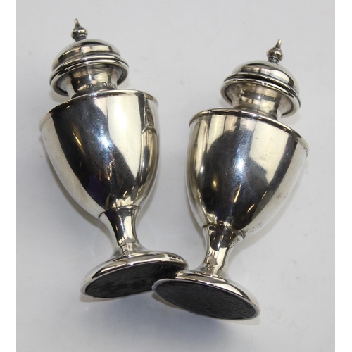 1172 - A pair of boxed silver pepperettes, Birmingham 1910 by Broadway & Co, approx 43.4g gross