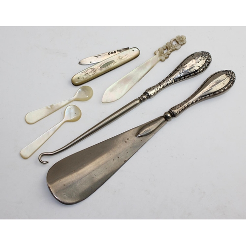 1175 - Silver handled shoe horn, button hook, silver bladed fruit knife with mother of pearl scales and oth... 