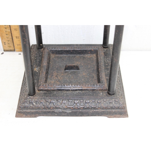 193 - An antique cast iron and painted brass stick or umbrella stand