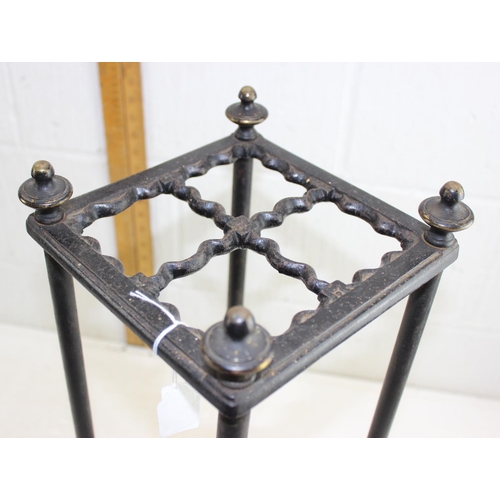 193 - An antique cast iron and painted brass stick or umbrella stand