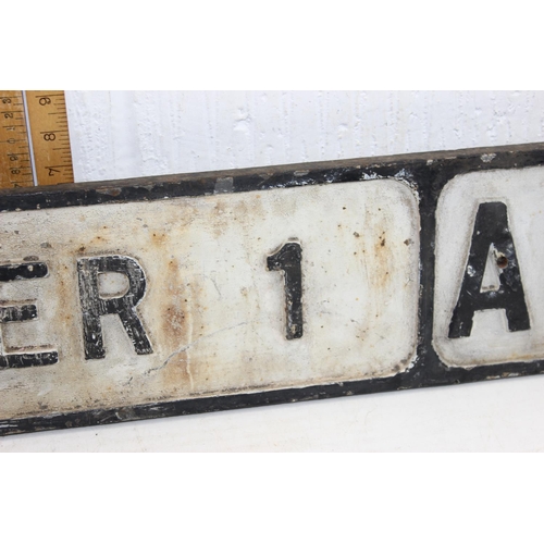 526 - An early to mid 20th century cast iron road sign, 'Exeter 1 Mile A377'