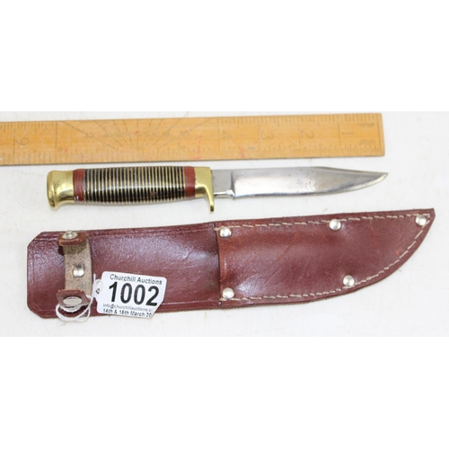 1002 - Vintage hunting knife with stacked handle and leather scabbard