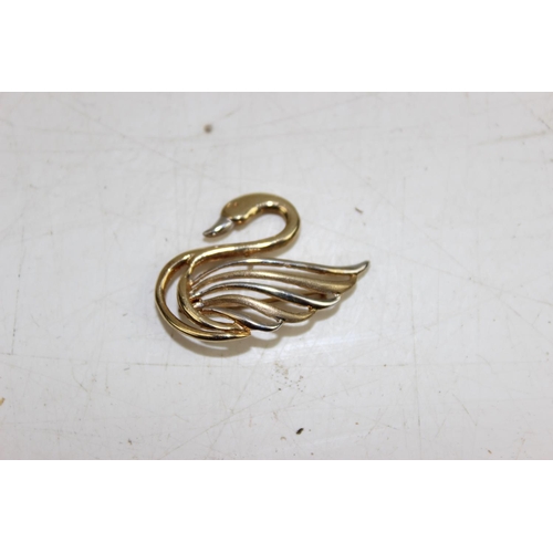 1209 - A 9ct gold brooch formed as a swan, yellow and white gold mix, approx 2.11g gross weight