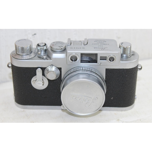 726 - Leica DBP Ernst Leitz GMBR Wetzlar Germany camera, with Elmar f=5cm 1:2.8 lens with lens cap, in ori... 