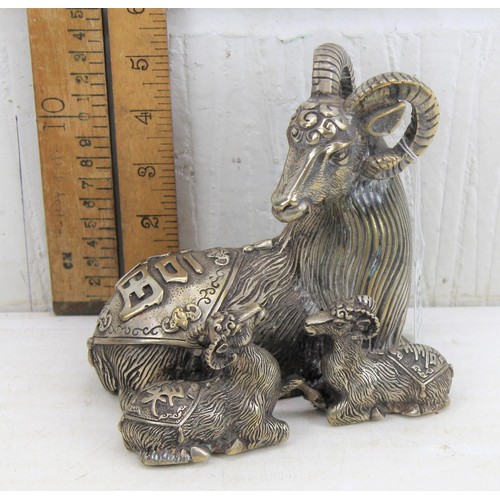 1163 - A large Chinese silver plated model of a goat and kids, seal mark to base