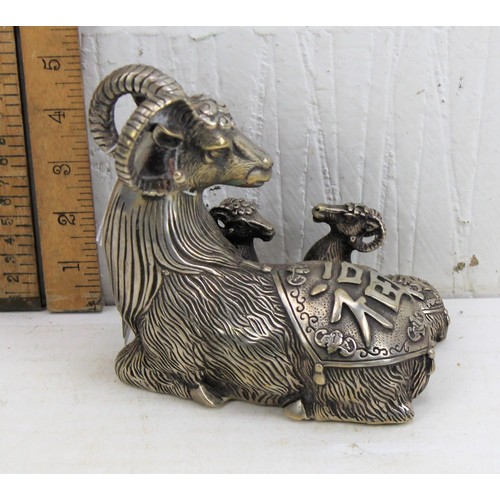 1163 - A large Chinese silver plated model of a goat and kids, seal mark to base