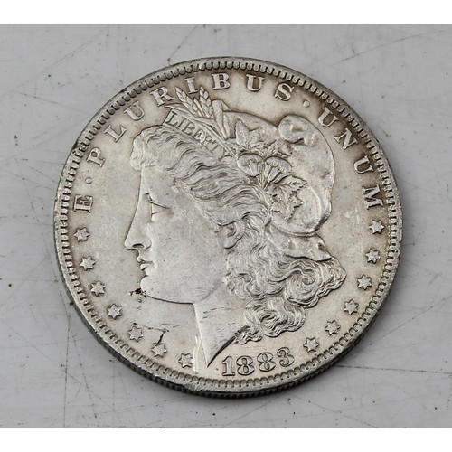 1338 - Coins - 1883 US silver Morgan dollar, New Orleans mint, approx 26.8g gross