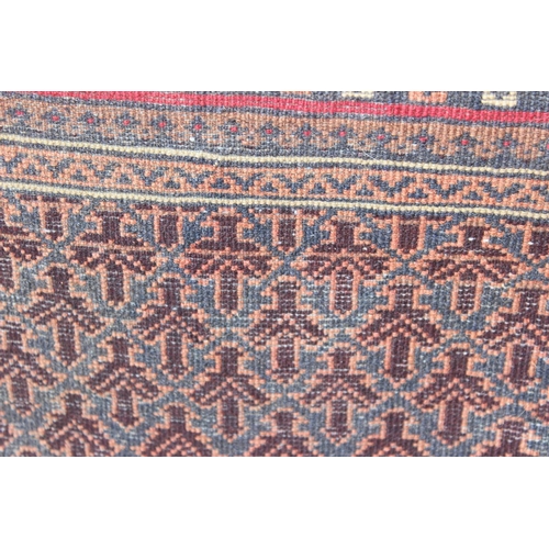 200 - A vintage handmade prayer rug with geometric design, approx 140cm x 90cm, import label verso