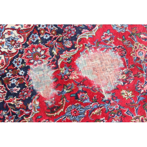 206 - A large good quality and highly decorative rug, likely Iranian of red & blue ground, approx 377cm x ... 
