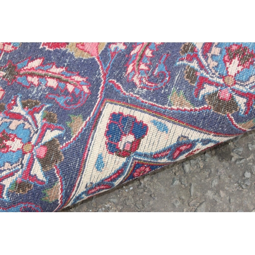 208 - A large decorative Persian rug of red ground with Herati border, approx 362cm x 271cm, label verso