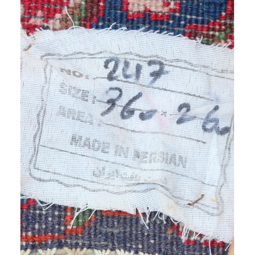 208 - A large decorative Persian rug of red ground with Herati border, approx 362cm x 271cm, label verso