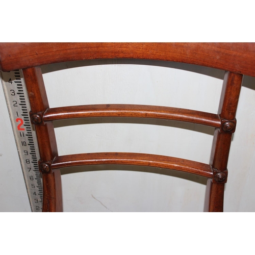 28 - A set of 6 late Regency or William IV rail back mahogany dining chairs with drop in seats and sabre ... 