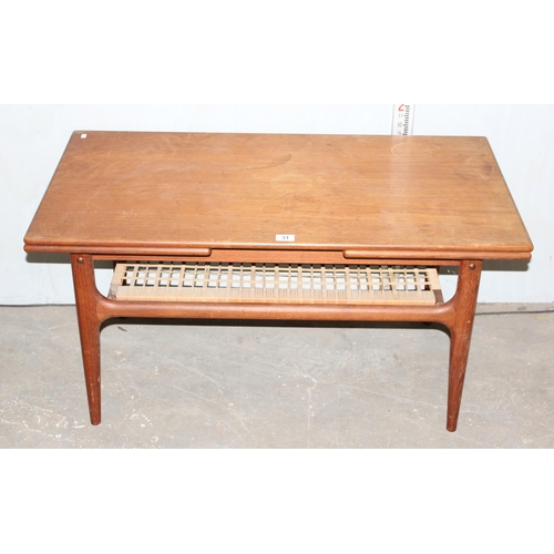 31 - Retro coffee with wickerwork magazine rack and extending ends, likely Danish but unmarked