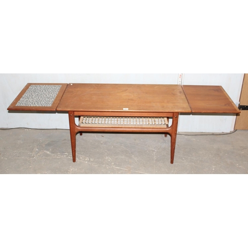 31 - Retro coffee with wickerwork magazine rack and extending ends, likely Danish but unmarked