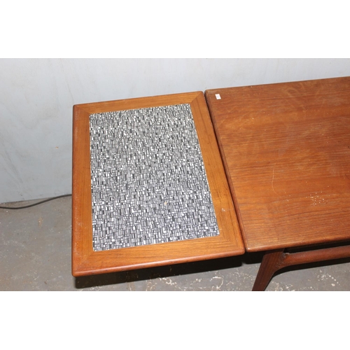 31 - Retro coffee with wickerwork magazine rack and extending ends, likely Danish but unmarked