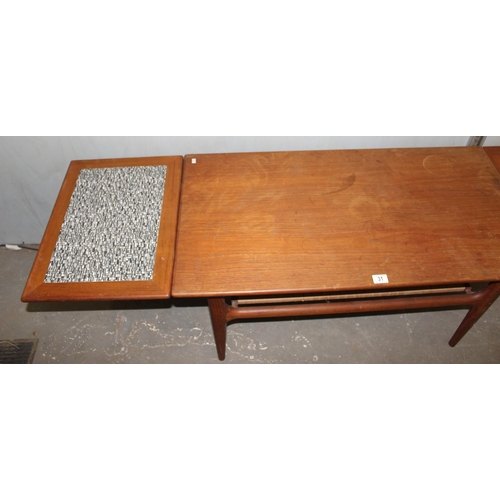 31 - Retro coffee with wickerwork magazine rack and extending ends, likely Danish but unmarked