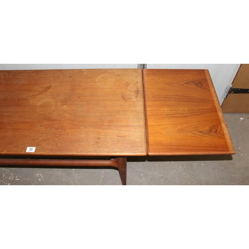 31 - Retro coffee with wickerwork magazine rack and extending ends, likely Danish but unmarked