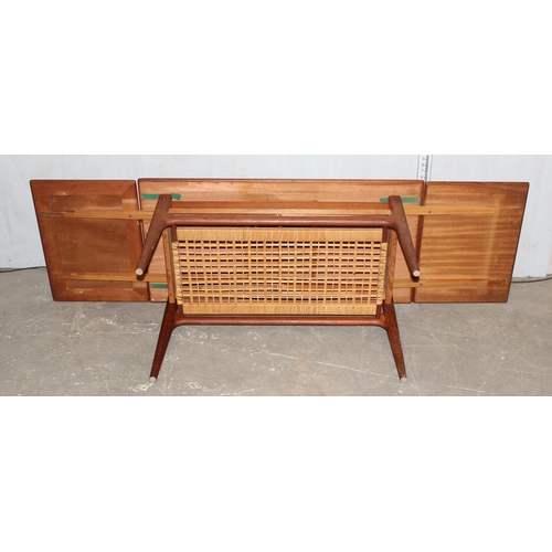 31 - Retro coffee with wickerwork magazine rack and extending ends, likely Danish but unmarked