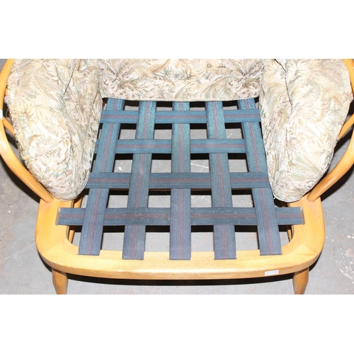 34 - Ercol armchair with stick back and upholstered cushions