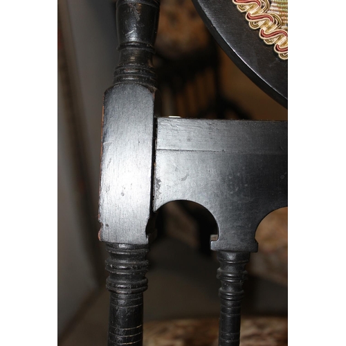 80 - A pair of Victorian ebonised low chairs of unusual form