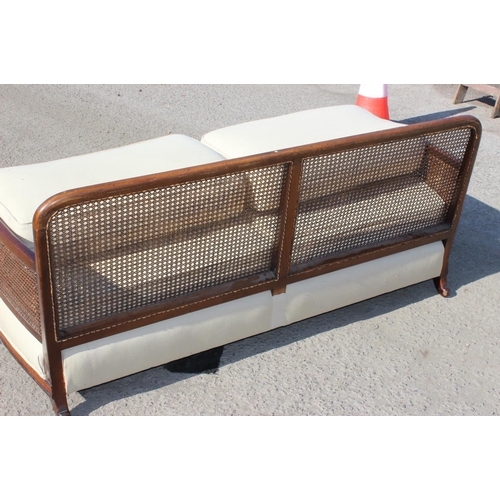87 - An Art Deco period bergere seated sofa and armchair with mahogany frame