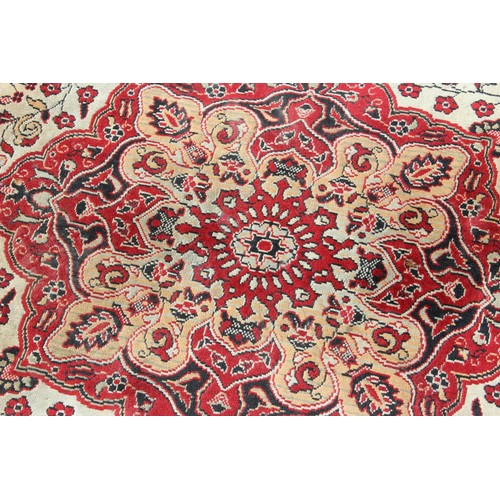 213 - A large decorative rug, likely Turkish, approx 213cm x 127cm