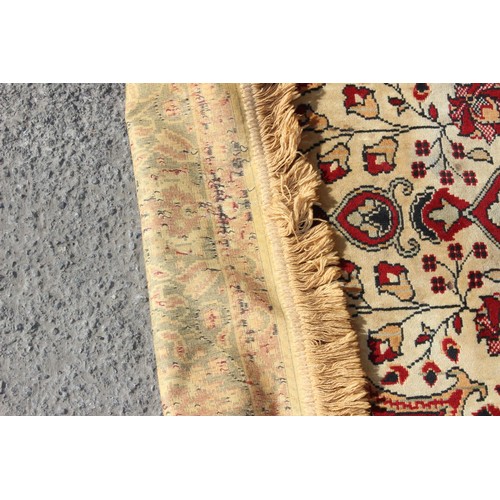 213 - A large decorative rug, likely Turkish, approx 213cm x 127cm