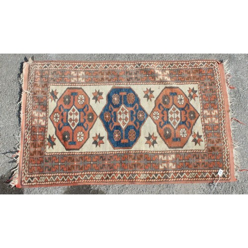 218 - A vintage small rug of cream ground with 3 medallions, approx 140cm x 87cm