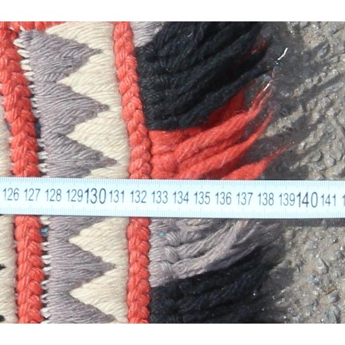 221 - An unusual flat weave rug of colourful geometric pattern